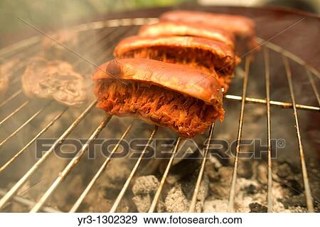 Stock Photo - Sausage, or chorizo, is grilled in Prado del Rey, Sierra de Cadiz, Cadiz province, Andalusia, Spain, May 23, 2010. Fotosearch