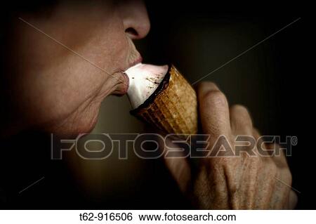 Stock Photograph - Savoring an ice cream. Fotosearch