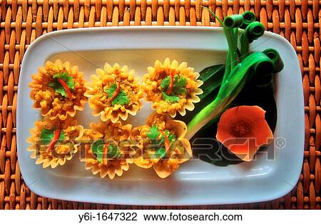 Savoury rice and corn in Thai krathongs or pastry shells with decorative spring onions View Large Photo Image Stock Image - Savoury rice and corn in Thai krathongs or pastry shells with decorative spring onions. Fotosearch
