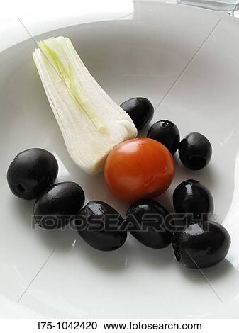 Stock Image - Scallion, olives and tomato. Fotosearch
