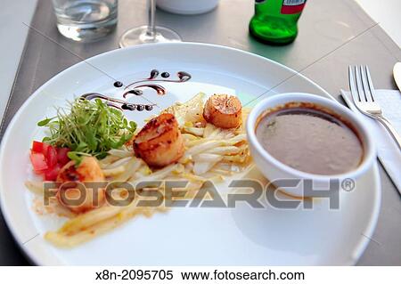 Scallops with endives in restaurant, Mechelen, West Flanders, Belgium. View Large Photo Image Stock Photography - Scallops with endives in restaurant, Mechelen, West Flanders, Belgium.. Fotosearch