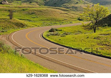 Scenic loop drive road, Theodore Roosevelt NP South Unit, North Dakota, USA View Large Photo Image Stock Photo - Scenic loop drive road, Theodore Roosevelt NP South Unit, North Dakota, USA. Fotosearch