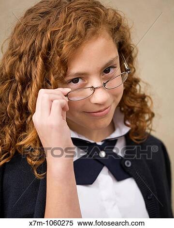 School age girl with glasses in school uniform Mixed race, Mexican and caucasian View Large Photo Image Stock Photography - School age girl with glasses in school uniform Mixed race, Mexican and caucasian. Fotosearch