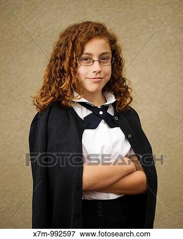 School age mixed race Mexican & caucasian girl with glasses in school uniform View Large Photo Image Stock Photo - School age mixed race Mexican & caucasian girl with glasses in school uniform. Fotosearch