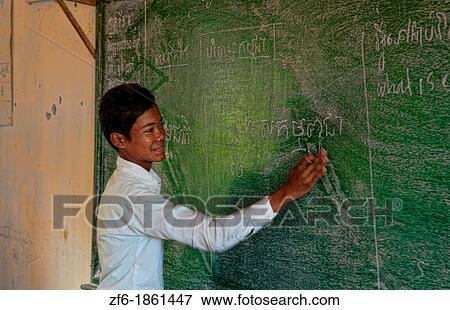 School boy inschool grade 8 writing on board near Siem Reap In Cambodia Asia View Large Photo Image Stock Photo - School boy inschool grade 8 writing on board near Siem Reap In Cambodia Asia. Fotosearch