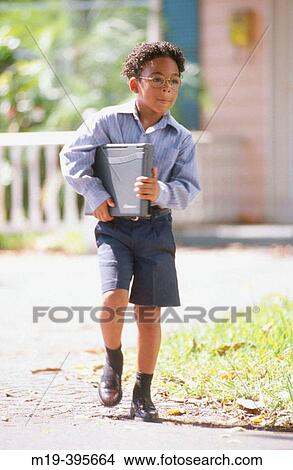 school boy leaving home with dcomputer View Large Photo Image Picture - school boy leaving home with dcomputer. Fotosearch