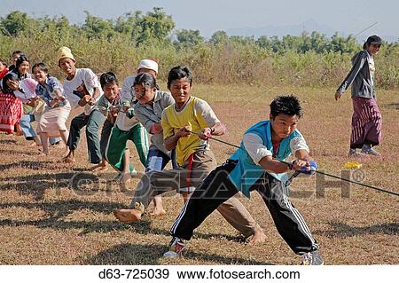 School children enjoying a tug of war game, Myitkyina, a largely Kachin community in north Burma near the Chinese border, Myanmar View Large Photo Image Stock Photo - School children enjoying a tug of war game, Myitkyina, a largely Kachin community in north Burma near the Chinese border, Myanmar. Fotosearch