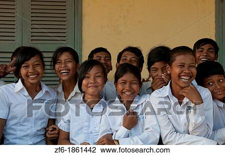 Stock Image - School children in elementary school grades 3 thru 8 near Siem Reap In Cambodia Asia. Fotosearch