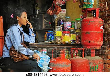 School girl talking on the phone at the shop View Large Photo Image Stock Image - School girl talking on the phone at the shop. Fotosearch