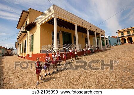 School kids walking on the Main Square-Plaza Mayor, Trinidad, Sancti Spiritus Province, Cuba, West Indies, Central America. View Large Photo Image Stock Image - School kids walking on the Main Square-Plaza Mayor, Trinidad, Sancti Spiritus Province, Cuba, West Indies, Central America.. Fotosearch
