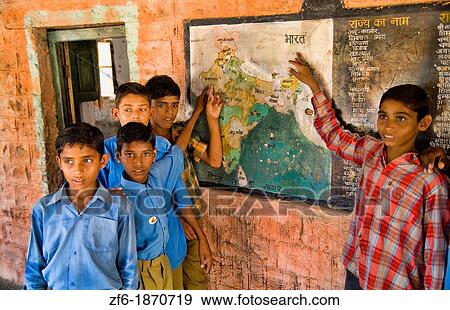 Stock Photo - School portrait in elementary school near Jodhpur in town of Rinawey Upper Primary School India showing where India is on map students ages 10 thru 12 in Rajasthan India. Fotosearch