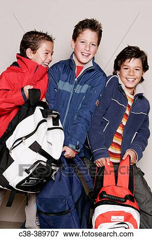 Schoolboys Carrying Their School Bags View Large Photo Image Stock Photo - Schoolboys Carrying Their School Bags. Fotosearch
