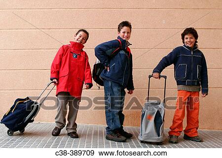 Schoolboys Carrying Their School Bags View Large Photo Image Stock Photo - Schoolboys Carrying Their School Bags. Fotosearch