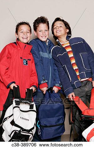 Schoolboys Carrying Their School Bags View Large Photo Image Stock Photograph - Schoolboys Carrying Their School Bags. Fotosearch