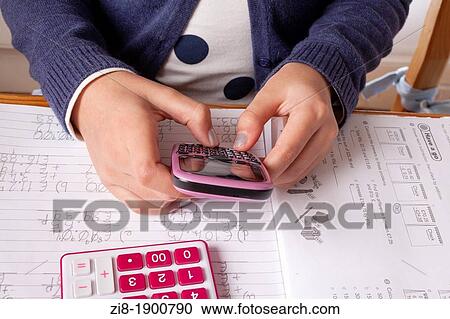 Schoolgirl sending text on mobile phone, View Large Photo Image Stock Image - Schoolgirl sending text on mobile phone,. Fotosearch