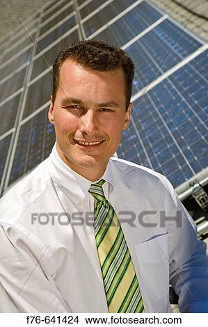 Science teacher with Solar collection panels on roof of school building, producing up to 12 KW of energy View Large Photo Image Picture - Science teacher with Solar collection panels on roof of school building, producing up to 12 KW of energy. Fotosearch