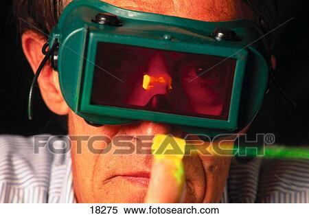 Scientist developing laser activated holographic memory storage device View Large Photo Image Stock Photography - Scientist developing laser activated holographic memory storage device. Fotosearch