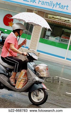 Scooter driver. Taiwan. Republic of China View Large Photo Image Stock Image - Scooter driver. Taiwan. Republic of China. Fotosearch