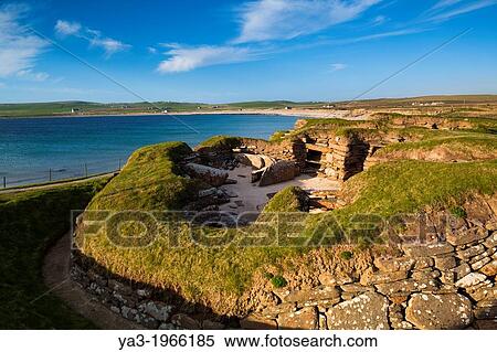Stock Photography - Scotland, Orkney Islands, Skara Brae Prehistoric Village. Skara Brae, a stone-built Neolithic settlement, located on the Bay of Skaill on the west coast of Mainland Orkney and forming part of the Heart of Neolithic Orkney World Heritage Site.. Fotosearch