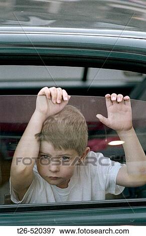 Scottish boy looking through a car window. Edinburgh. Scotland. UK. View Large Photo Image Stock Photo - Scottish boy looking through a car window. Edinburgh. Scotland. UK.. Fotosearch