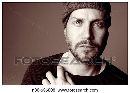 Scruffy man in hat, fashion View Large Photo Image Stock Photo - Scruffy man in hat, fashion. Fotosearch
