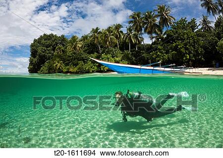 Picture - Scuba Diver in Lagoon of Ahe Island, Cenderawasih Bay, West Papua, Indonesia. Fotosearch