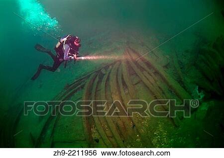 Stock Photograph - Scuba diver on shipwreck unknown sailboat 19th century, the Russian-Turkish war, Island Zmeinyj (Snake), Black Sea, Ukraine, Eastern Europe, Europe.. Fotosearch