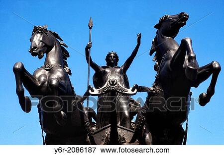 Stock Photo - Sculpture of Queen Boudica, who rebelled against the Roman Empire in the First Century AD, outside the Houses of Parliament, in Westminster, London, on a sunny day.. Fotosearch