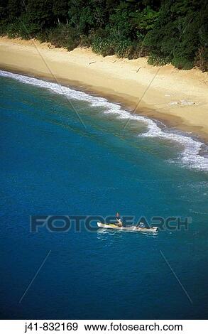 Stock Photo - Sea kayaking in Te Puketea Bay Abel Tasman National Park New Zealand. Fotosearch