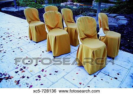 Seats outdoors in the evening View Large Photo Image Stock Photograph - Seats outdoors in the evening. Fotosearch