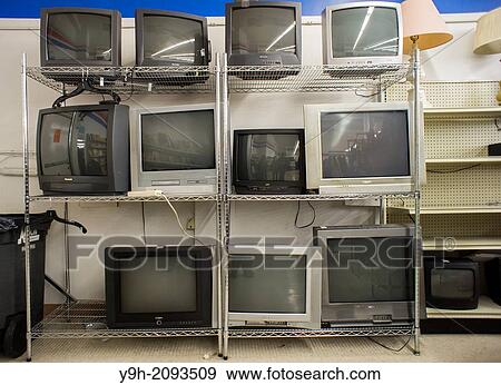 Second-hand CRT analog television sets are seen lined up for sale in a thrift store in New York. Three years ago the country switched from analog to digital television with converter boxes being used on older sets such as these. View Large Photo Image Stock Photo - Second-hand CRT analog television sets are seen lined up for sale in a thrift store in New York. Three years ago the country switched from analog to digital television with converter boxes being used on older sets such as these.. Fotosearch
