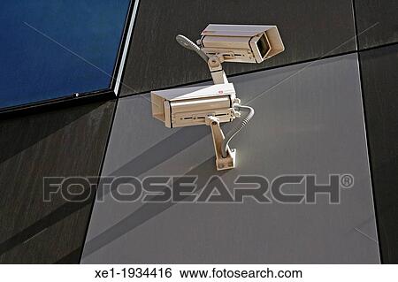 Stock Photograph - security cameras, Endesa building, Barcelona, Catalonia, Spain.. Fotosearch
