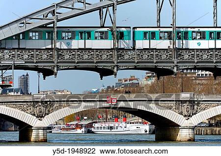 Seine river banks, listed as World Heritage by UNESCO, metro train on Viaduc D? Austerlitz, metro train on Austerlitz viaduct, people walking on Pont D? Austerlitz, people walking on Austerlitz bridge, Paris, France View Large Photo Image Stock Image - Seine river banks, listed as World Heritage by UNESCO, metro train on Viaduc D? Austerlitz, metro train on Austerlitz viaduct, people walking on Pont D? Austerlitz, people walking on Austerlitz bridge, Paris, France. Fotosearch