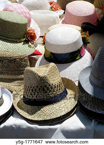selection of straw hats on outdoor market stall View Large Photo Image Stock Photo - selection of straw hats on outdoor market stall. Fotosearch
