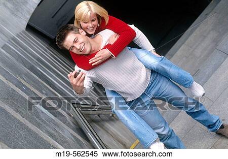 self photo of a piggy-back couple View Large Photo Image Stock Photography - self photo of a piggy-back couple. Fotosearch