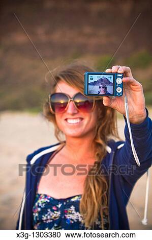 Stock Image - Self picture as seen through a digital viewfinder on Polihale State Beach, Kauai, Hawaii, USA. Fotosearch