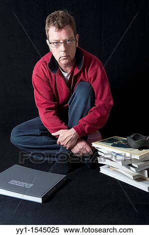 Self-portrait of a photographer, with photo-books in his studio. View Large Photo Image Stock Photography - Self-portrait of a photographer, with photo-books in his studio.. Fotosearch