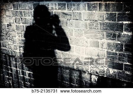 Selfportrait of a photographer with the shadow reflected in a wall of bricks in London, England, UK, Europe View Large Photo Image Stock Image - Selfportrait of a photographer with the shadow reflected in a wall of bricks in London, England, UK, Europe. Fotosearch