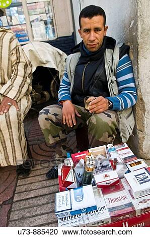Selling cigarettes in downtown Casablanca, Morocco View Large Photo Image Stock Image - Selling cigarettes in downtown Casablanca, Morocco. Fotosearch