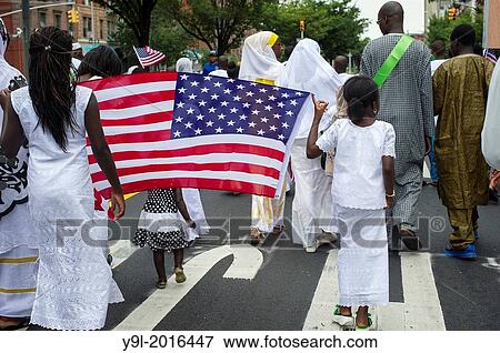 Sengalese immigrants participate in a parade in Harlem in New York commemorating their Shaykh Ahmadou Bamba during the Murid Islamic Community in America MICA cultural weeks celebration. View Large Photo Image Stock Photo - Sengalese immigrants participate in a parade in Harlem in New York commemorating their Shaykh Ahmadou Bamba during the Murid Islamic Community in America MICA cultural weeks celebration.. Fotosearch