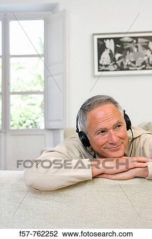 Seniar man listening music View Large Photo Image Stock Image - Seniar man listening music. Fotosearch