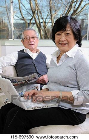 Stock Image - Senior asian couple enjoy spending time together. Fotosearch