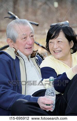 Senior asian couple having fun together relaxing in the outdoor View Large Photo Image Stock Image - Senior asian couple having fun together relaxing in the outdoor. Fotosearch