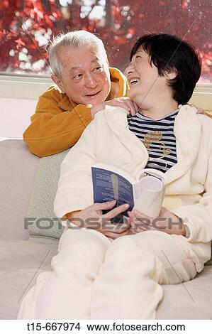 Senior Asian couple looking at each other smiling View Large Photo Image Picture - Senior Asian couple looking at each other smiling. Fotosearch