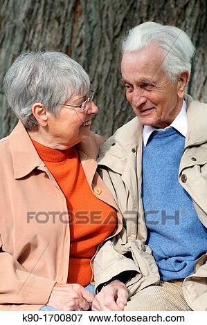 Stock Photo - Senior caucasian couple, looking at each other, talking, Hamburg, Germany, Europe. Fotosearch