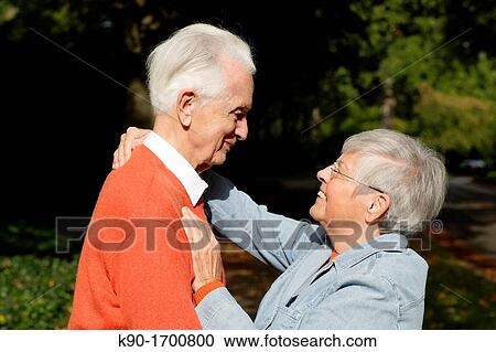 Senior caucasian couple, looking happily at each other and holding each other, Hamburg, Germany, Europe View Large Photo Image Stock Image - Senior caucasian couple, looking happily at each other and holding each other, Hamburg, Germany, Europe. Fotosearch