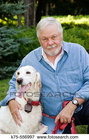 Senior Caucasian man with English setter View Large Photo Image Stock Photo - Senior Caucasian man with English setter. Fotosearch