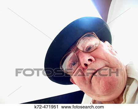 Senior Citizen With Black Hat Looking Down View Large Photo Image Stock Image - Senior Citizen With Black Hat Looking Down. Fotosearch