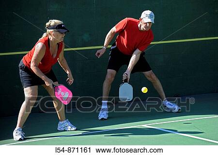 Senior citizens compete in game of Pickleball in the Senior state Olympics near Naples Florida View Large Photo Image Stock Image - Senior citizens compete in game of Pickleball in the Senior state Olympics near Naples Florida. Fotosearch
