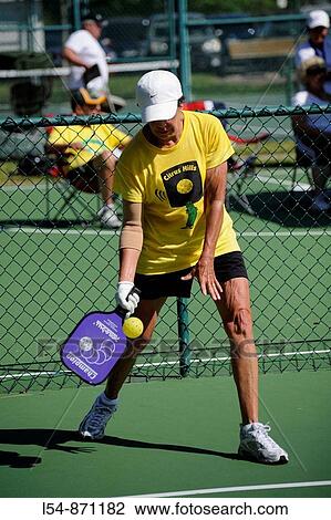 Senior citizens compete in game of Pickleball in the Senior state Olympics near Naples Florida View Large Photo Image Stock Image - Senior citizens compete in game of Pickleball in the Senior state Olympics near Naples Florida. Fotosearch